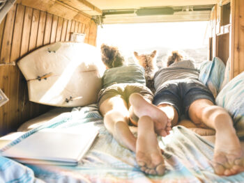 Hipster,Couple,With,Cute,Dog,Traveling,Together,On,Vintage,Van